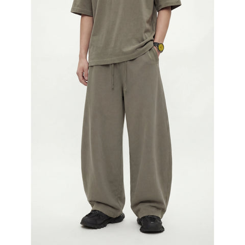 Kanye stretchy distressed washed curved-leg pants