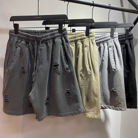 KANYE's high-end washed and distressed denim shorts