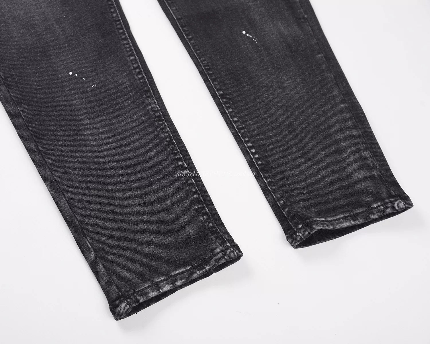 KANYE's distressed ink-print stretch denim pants