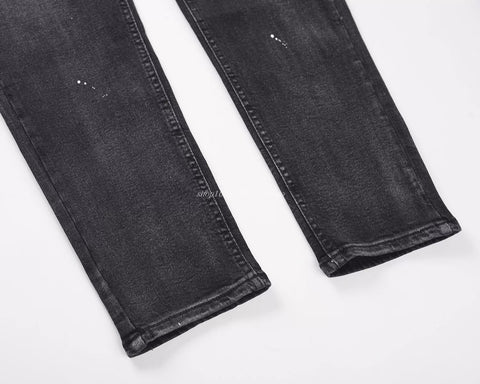 KANYE's distressed ink-print stretch denim pants
