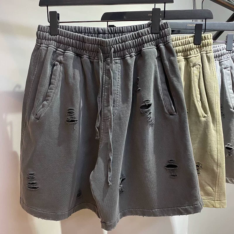 KANYE's high-end washed and distressed denim shorts