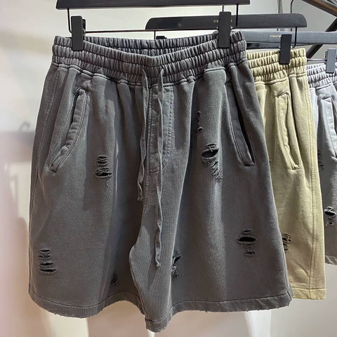 KANYE's high-end washed and distressed denim shorts